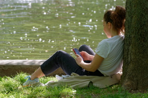 Girl relaxing on lakeshore